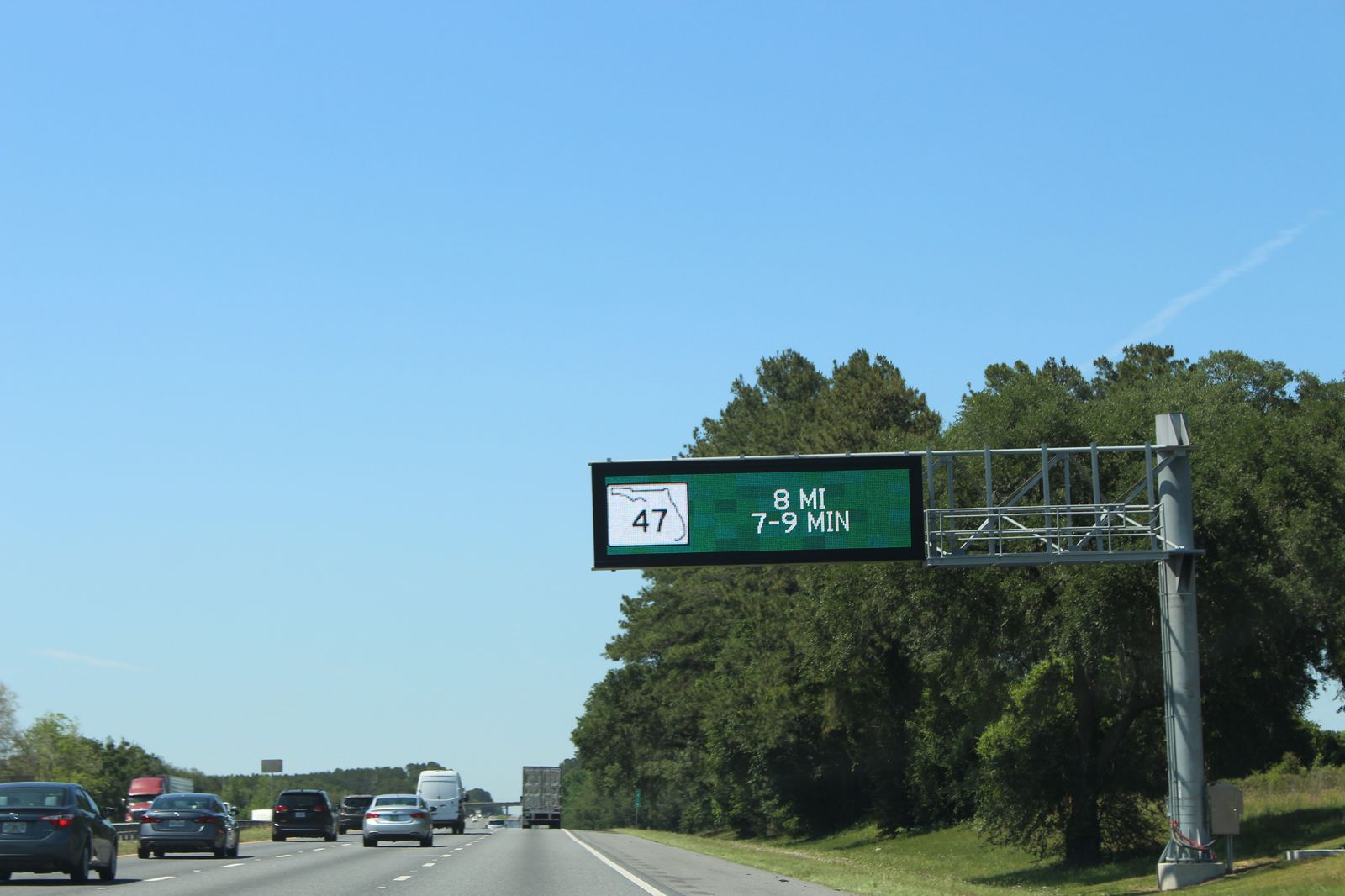 Dynamic message sign with travel times over I-75 in Florida