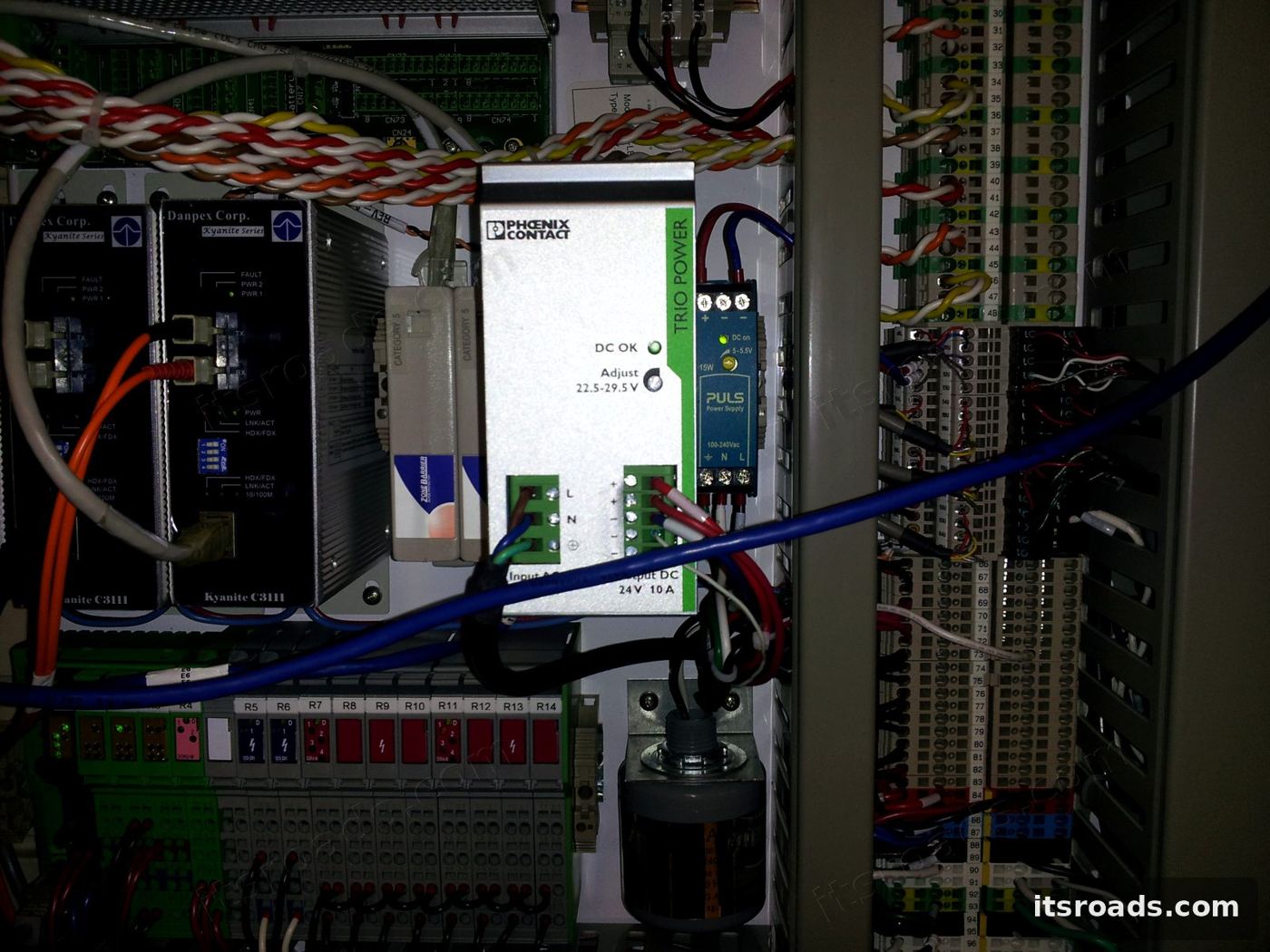 Toll lane cabinet power supplies and industrial I/O controllers on a bench
