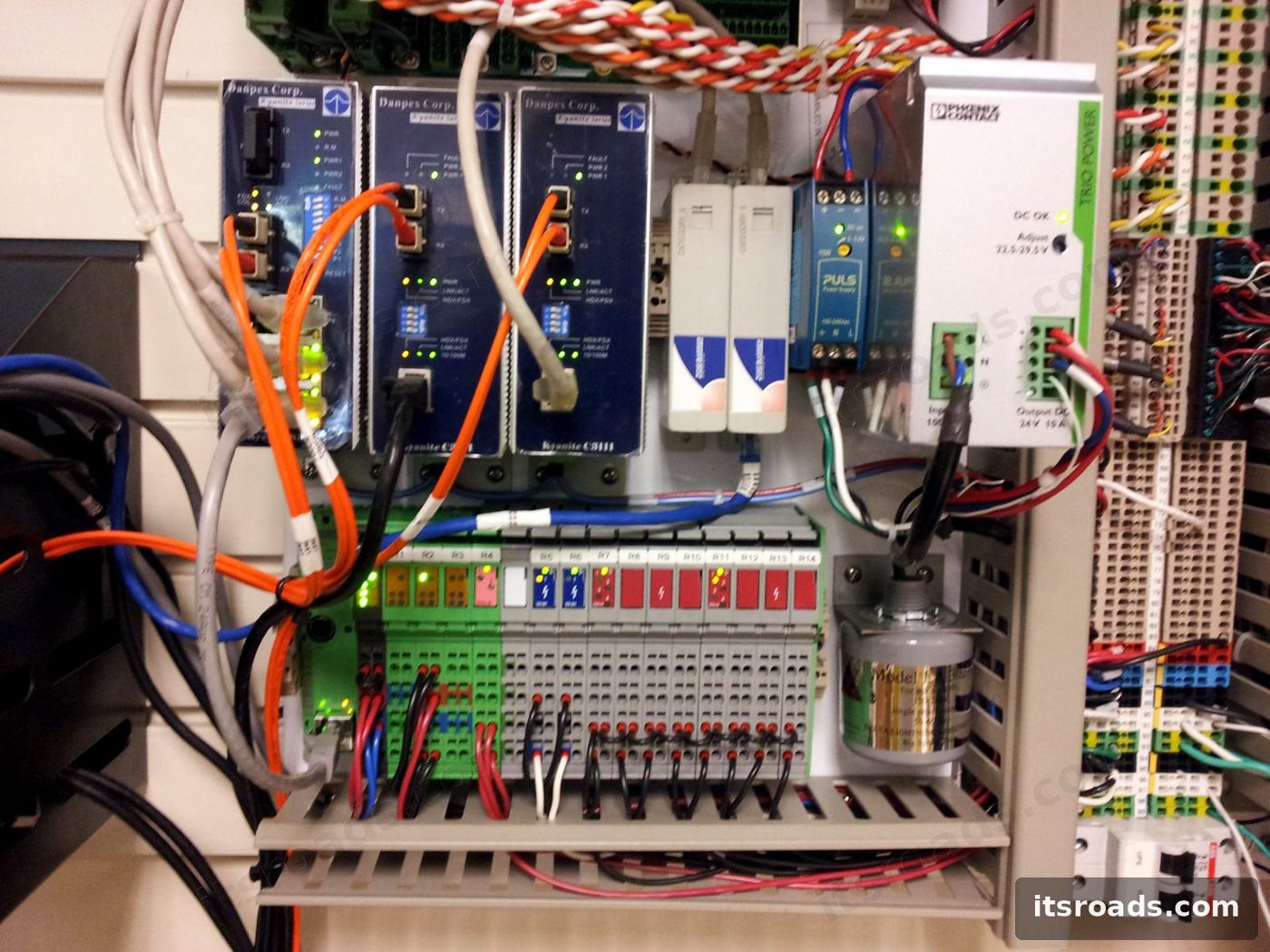 Toll lane cabinet back panel with controllers and power supplies