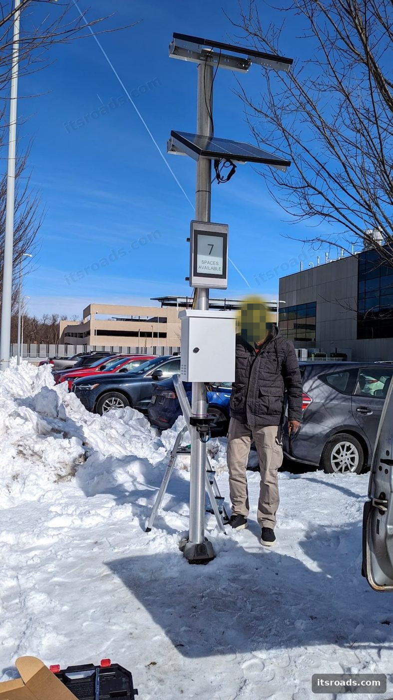 Solar-powered pole-mounted sensor installation in winter conditions