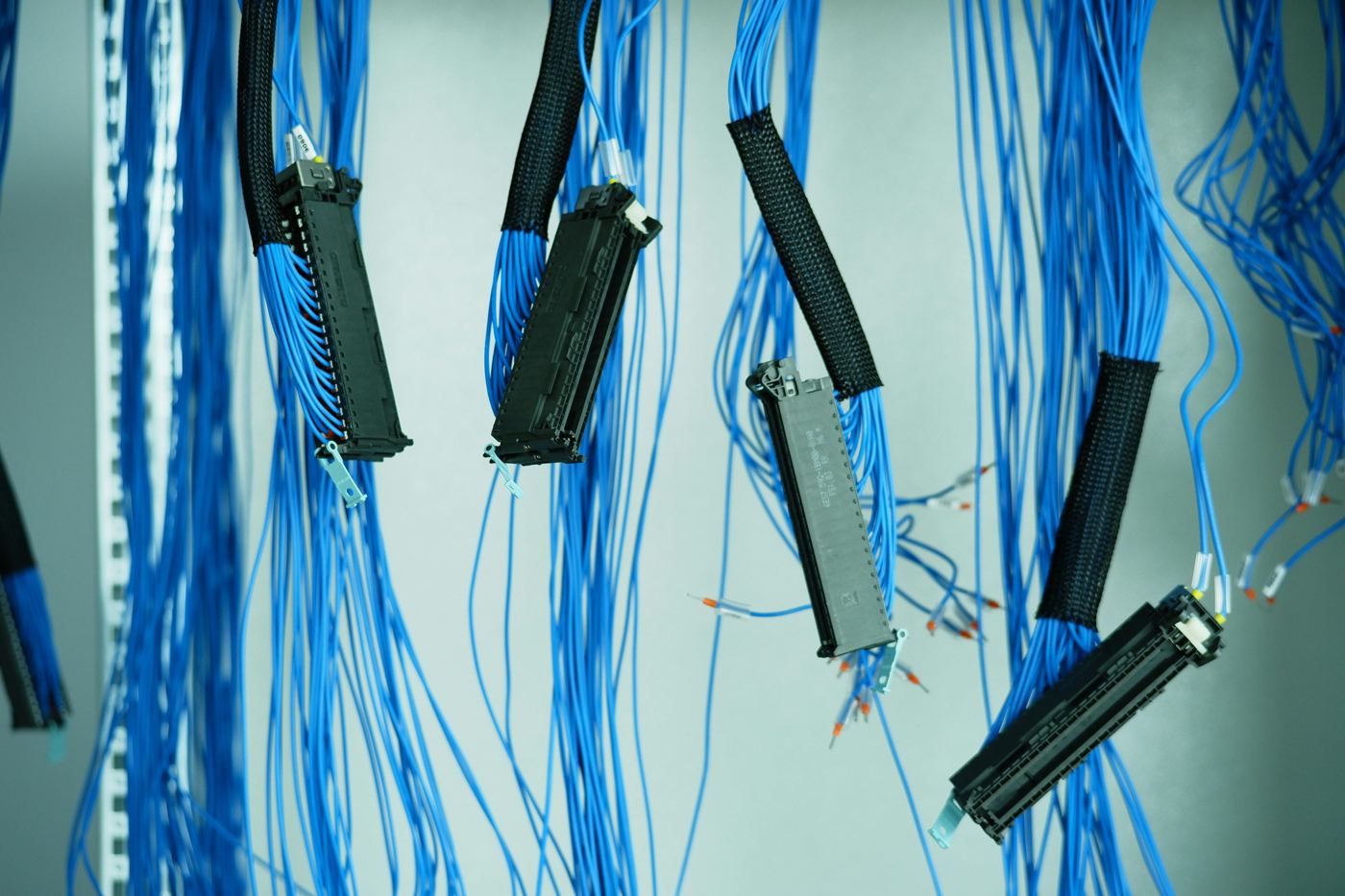 Bundles of network cables in a communications cabinet
