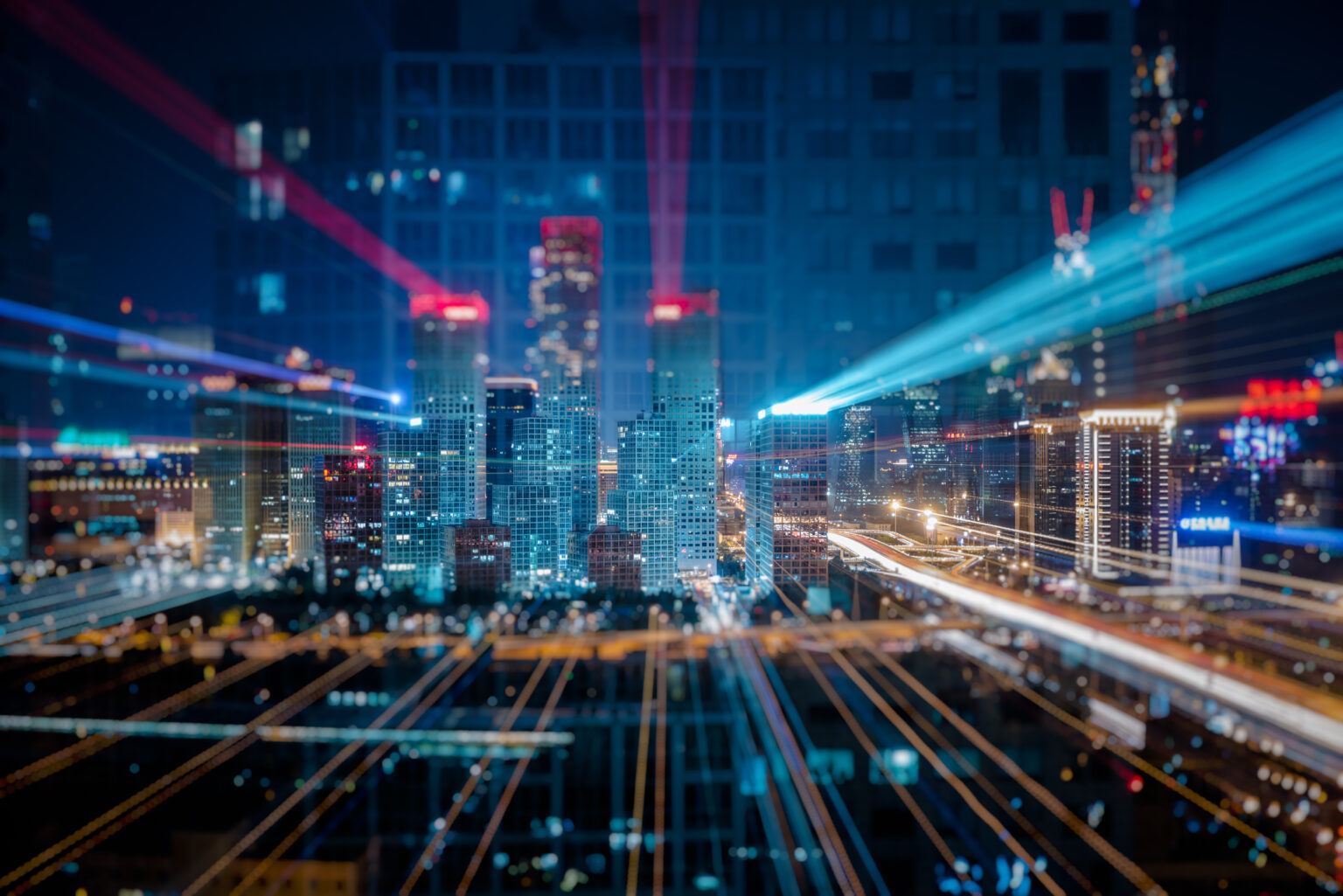 City skyline with light trails representing data and connectivity