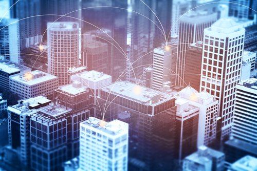 City skyline with connected network overlay